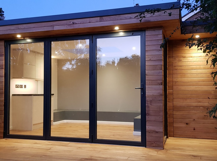 Aluminum Bi-Folding Doors for Bespoke Summer House in Oak